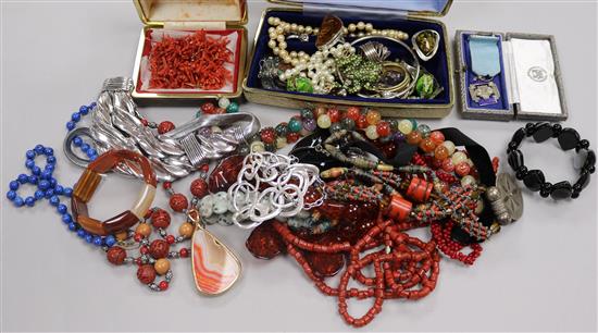 A collection of beads including coral and mixed costume jewellery.